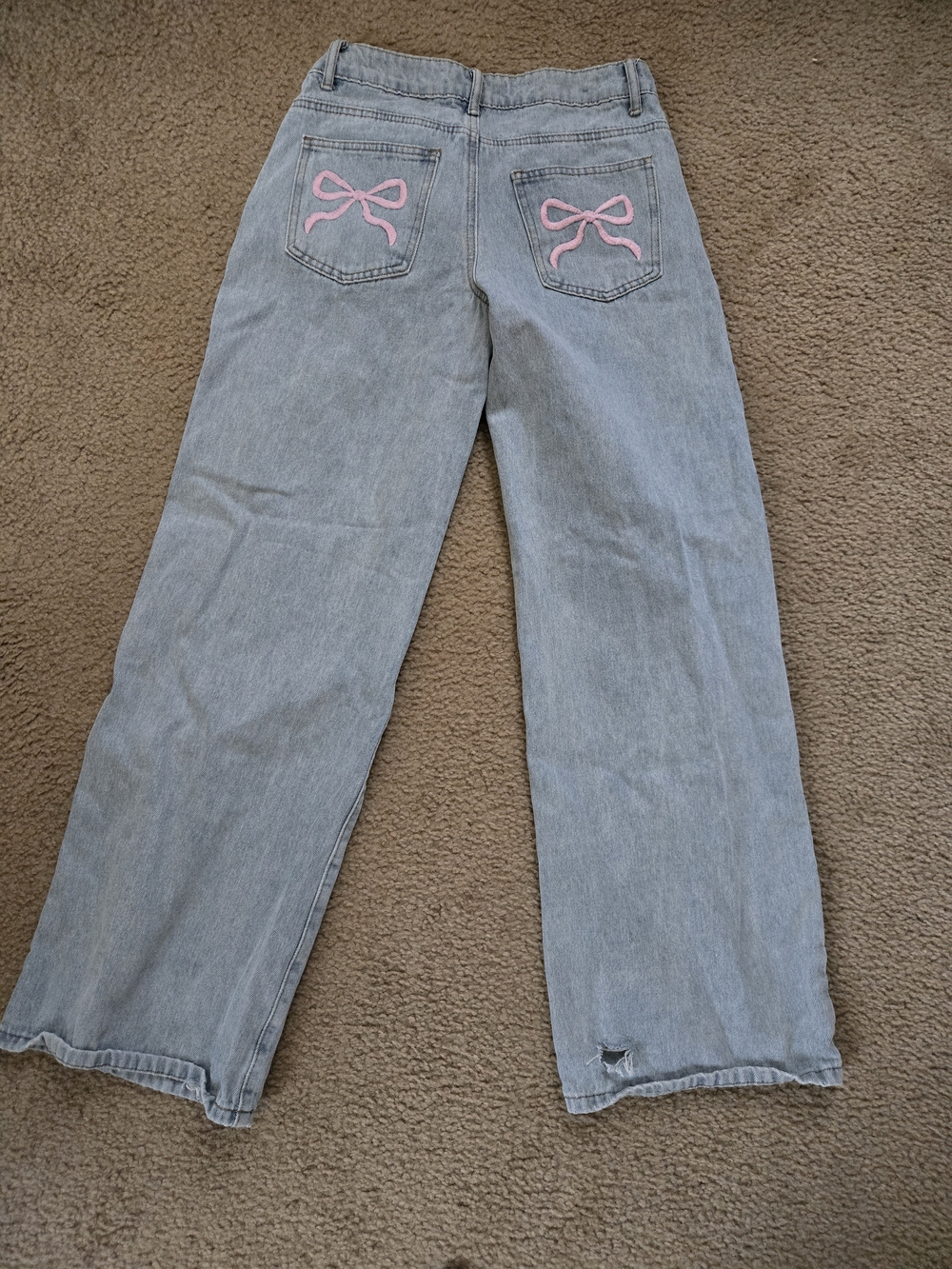 Edikted Light Wash Jeans with Pink Bow Back Pocket Details